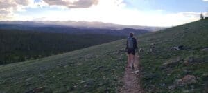 Kelly hikes along a path